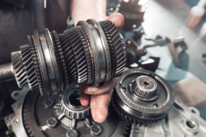 Car transmission being repaired by a mechanic in Cicero, Illinois