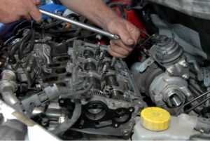 Auto mechanic repairing a transmission in West Chicago, Illinois